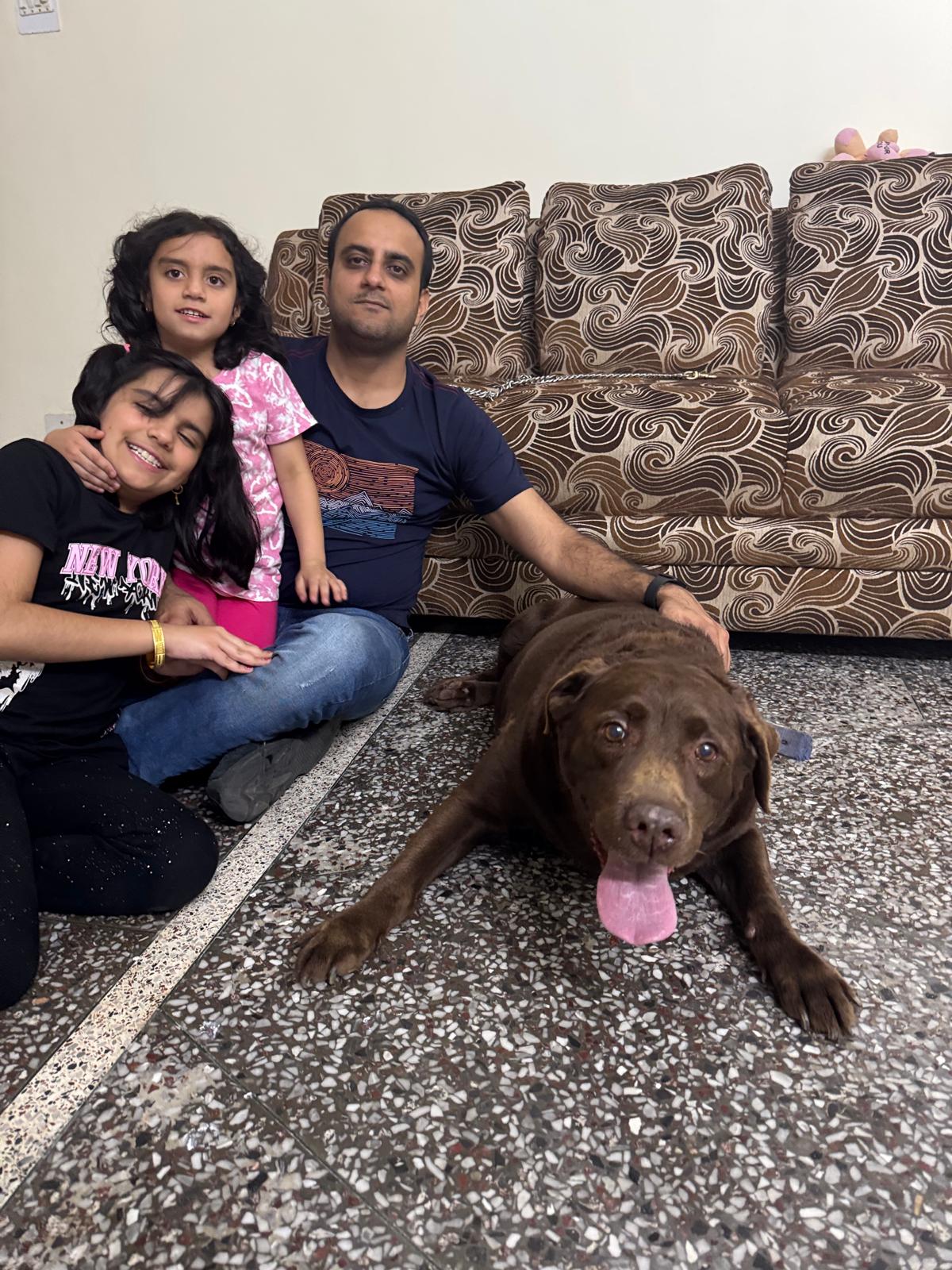 Dr. Arora with his family and dog